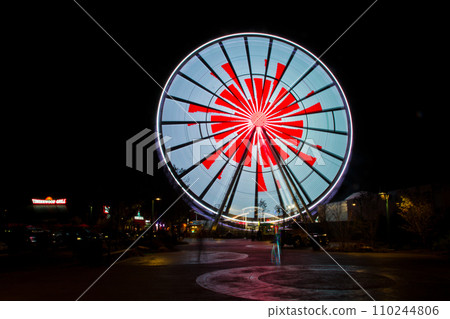 Glowing Ferris Wheel in Night Sky at Timberwood Grill, Tennessee Glowing Ferris Wheel in Night Sky at Timberwood Grill, Tennessee 110244806