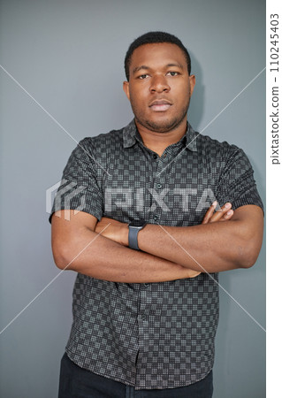 Portrait of an attractive cool guy on a gray background 110245403