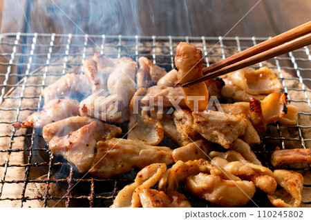 Grilled chicken thigh with shichirin Grilled chicken thigh with shichirin 110245802