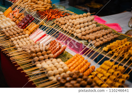 Skewers of streetfood on a table in Thailand,Steamed hot dogs Skewers of streetfood on a table in Thailand,Steamed hot dogs 110246641