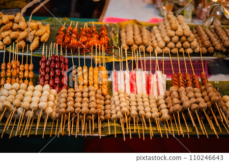 Skewers of streetfood on a table in Thailand,Steamed hot dogs 110246643