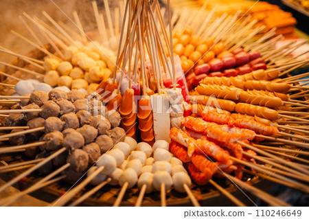 Skewers of streetfood on a table in Thailand,Steamed hot dogs 110246649