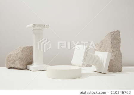 Stone slabs and white pedestals are displayed on a white background. Empty space for product display. Minimalist concept for advertising. Front view. 110246703