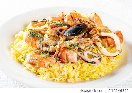 white table and paella white table and paella 110246813