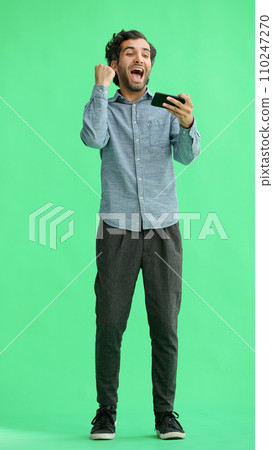 young man in full growth. isolated on green background taking selfie young man in full growth. isolated on green background taking selfie 110247270