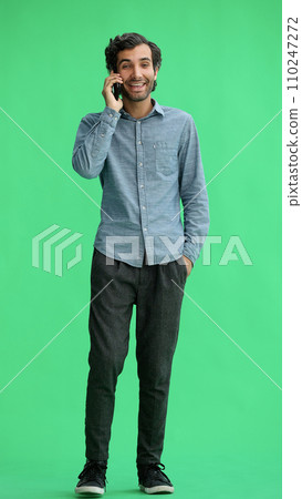 young man in full growth. isolated on green background taking selfie young man in full growth. isolated on green background taking selfie 110247272