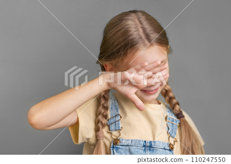 A little girl shows a sign of  protest with her hand 110247550