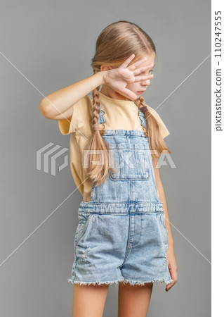 A little girl shows a sign of  protest with her hand 110247555