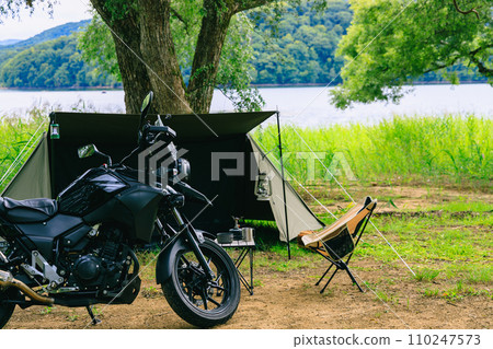 Camping tour by bike by the lake 110247573