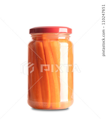Carrot sticks, homemade fermented carrots, in glass jar with lid. Carrots cut into sticks, fermented by lactic acid bacteria. Unpasteurized and uncooked they provide probiotics and improve digestion. 110247651