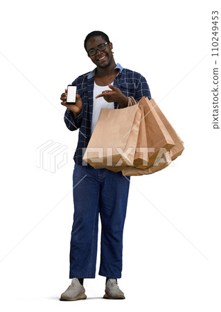 A man in a shirt on a White background with bags in his hands 110249453