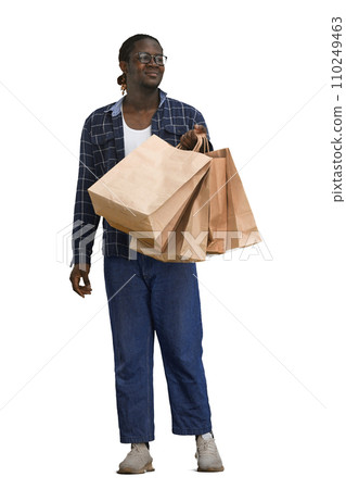 A man in a shirt on a White background with bags in his hands A man in a shirt on a White background with bags in his hands 110249463