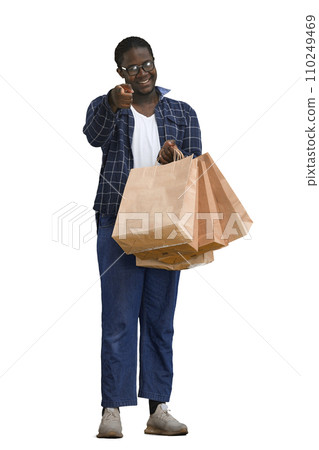 A man in a shirt on a White background with bags in his hands 110249469