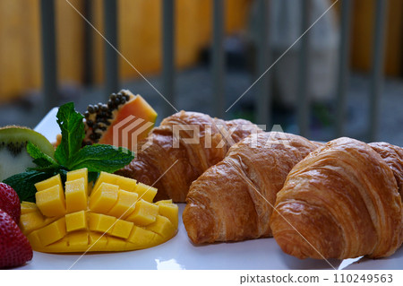 delicious croissant with fruits on a white plate serving cleanliness tidiness expensiveness the best lunch beautiful morning care care dear life delicious yamiyami 110249563