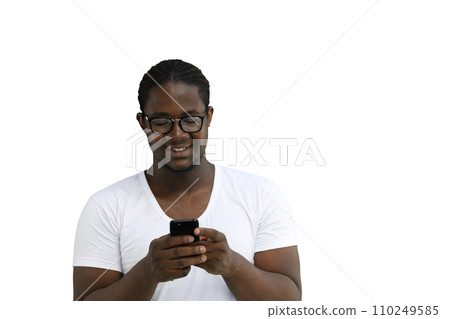 A man in a white T-shirt on a White background is typing on his phone A man in a white T-shirt on a White background is typing on his phone 110249585