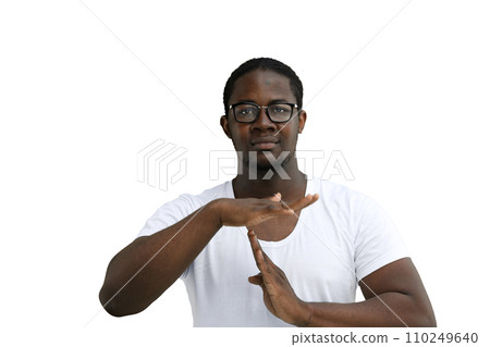 A man in a white T-shirt on a White background close-up shows pause sign A man in a white T-shirt on a White background close-up shows pause sign 110249640