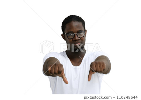 A man in a white T-shirt on a White background close-up shows thumbs down 110249644