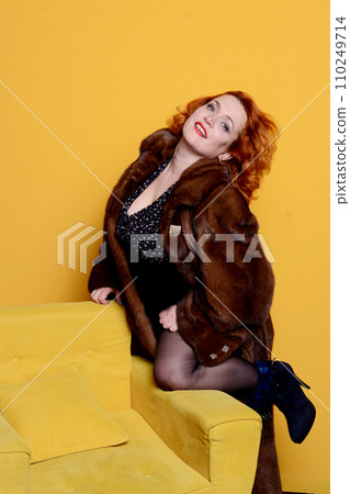 pretty woman posing in fashion style on yellow background, lifestyle people concept pretty woman posing in fashion style on yellow background, lifestyle people concept 110249714