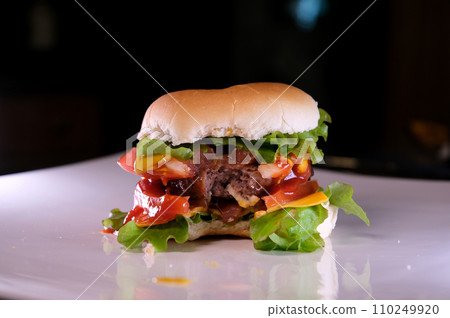Fresh tasty burger isolated on black background 110249920