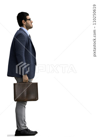 A man in an office suit with a briefcase on a White background, in profile 110250619