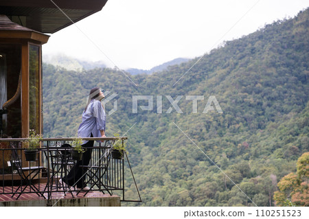 digital nomad concept asian freelancer woman relax and outdoor work at mountain view of coffeeshop 110251523