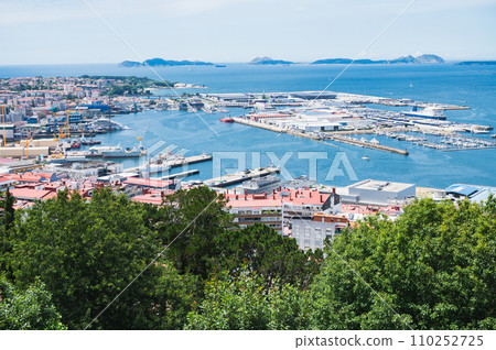 The view from the hill in Parque Monte del Castro, park located on a hill in Vigo, the biggest city in Galicia Region, in the North of Spain. View of the sea, harbour and docks, selective focus 110252725