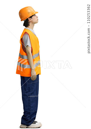 The guy is a builder, on a white background, in full height 110253362