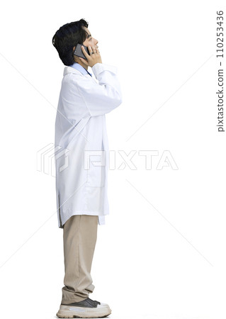 The guy is a doctor, on a white background, full-length, with a phone 110253436