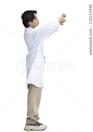 The doctor guy, on a white background, in full height, shows his fingers down 110253446