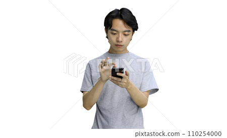 Guy in a gray T-shirt, on a white background, close-up, with a phone 110254000