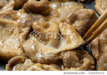Grilled pork with ginger, cooking scene. Grilled pork with ginger, cooking scene. 110254213