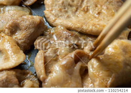 Grilled pork with ginger, close up of cooking scene. Grilled pork with ginger, close up of cooking scene. 110254214