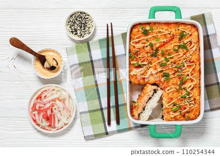 sushi bake with salmon, rice, seaweed, crab meat sushi bake with salmon, rice, seaweed, crab meat 110254344