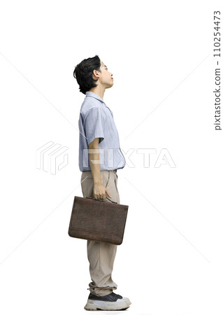 A guy in a blue shirt, on a white background, full-length, with a briefcase 110254473