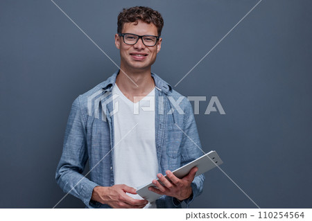 portrait of a young man on a gray background portrait of a young man on a gray background 110254564