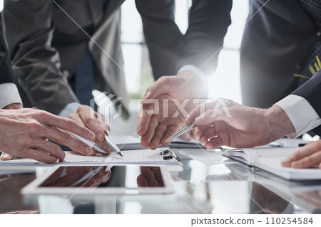 men close-up, looking in a folder with documents 110254584
