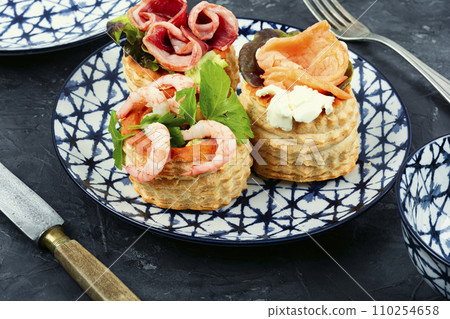 Tartlets with seafood and bacon, tasty snack. Tartlets with seafood and bacon, tasty snack. 110254658