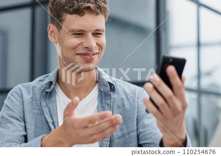 Smiling Businessman Talking on his Cell Phone Smiling Businessman Talking on his Cell Phone 110254676