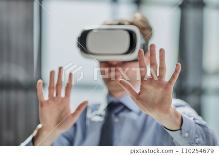 businessman in virtual reality headset in the office 110254679