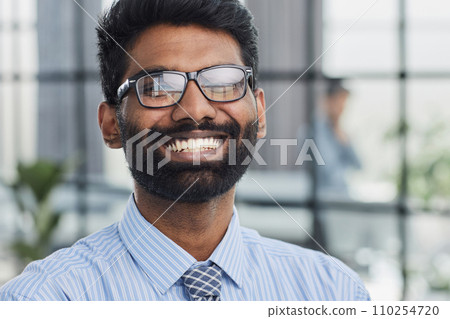 Close-up photo portrait of successful and happy businessman, male investor beard looking at camera 110254720