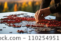 AI-generated content. Hand pressing button in red 3D city model closeup 110254951