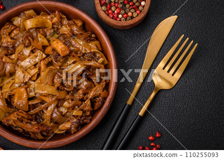 Delicious asian udon dish with vegetables, mushrooms, salt and spices Delicious asian udon dish with vegetables, mushrooms, salt and spices 110255093