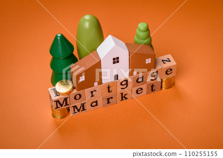 A small wooden house and keys as an idea for investing in your own home 110255155