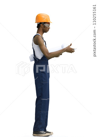 A male builder, on a white background, full-length, with drawings 110255161