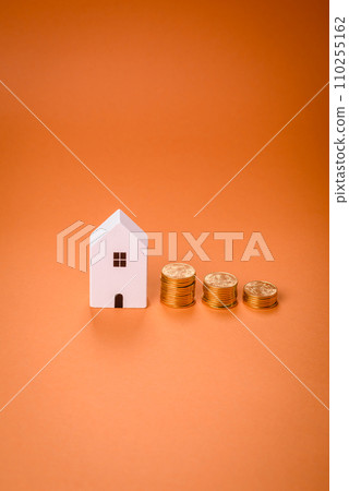 A small wooden house and keys as an idea for investing in your own home 110255162