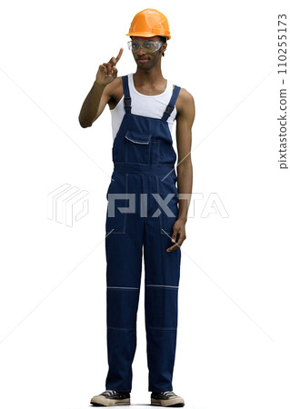 A male construction worker, on a white background, in full height, shows an important sign 110255173