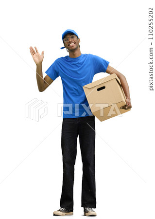 A male deliveryman, on a white background, full-length, with a box, waving his hand 110255202
