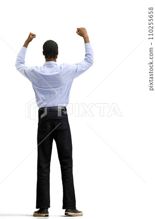 A man in a gray shirt, on a white background, in full height, raised his hands 110255658