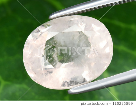 natural light morganite beryl gem on the background 110255899