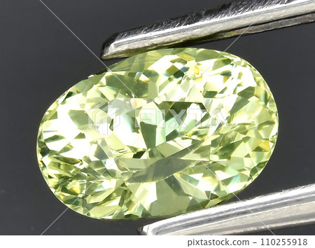 natural yellow grossular garnet gem on the background natural yellow grossular garnet gem on the background 110255918